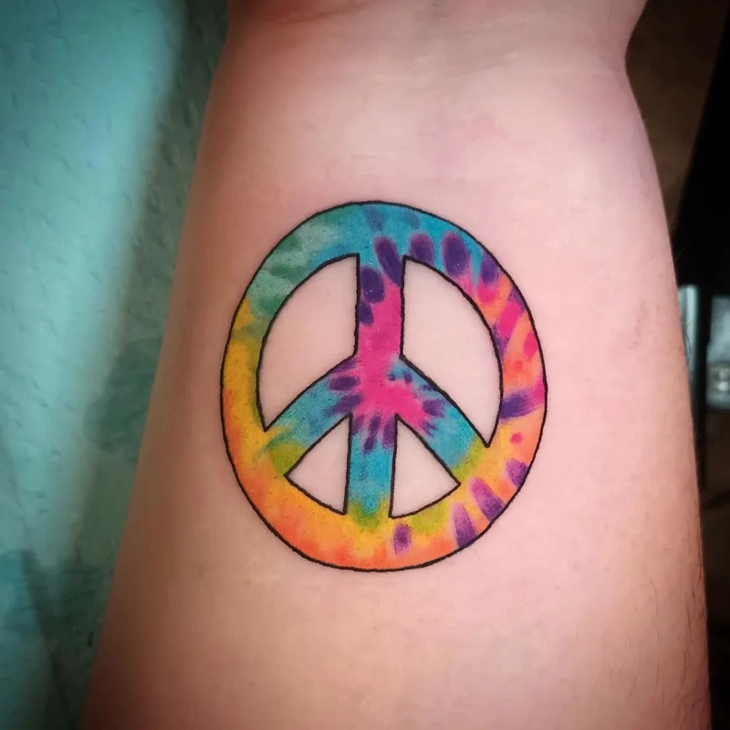 Peace tattoo done by Brian Haggerty at Overlord Tattoo Studio, Palm Coast, Flagler Beach FL. 