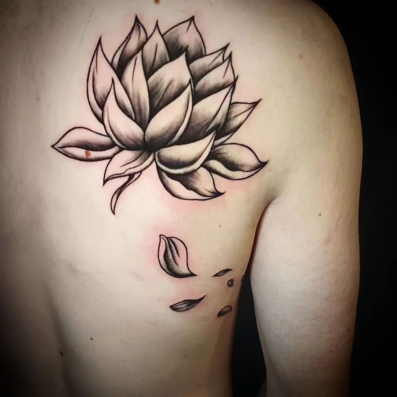Lotus flower tattoo done by Brian Haggerty at Overlord Tattoo Studio, Palm Coast, Flagler Beach FL. 