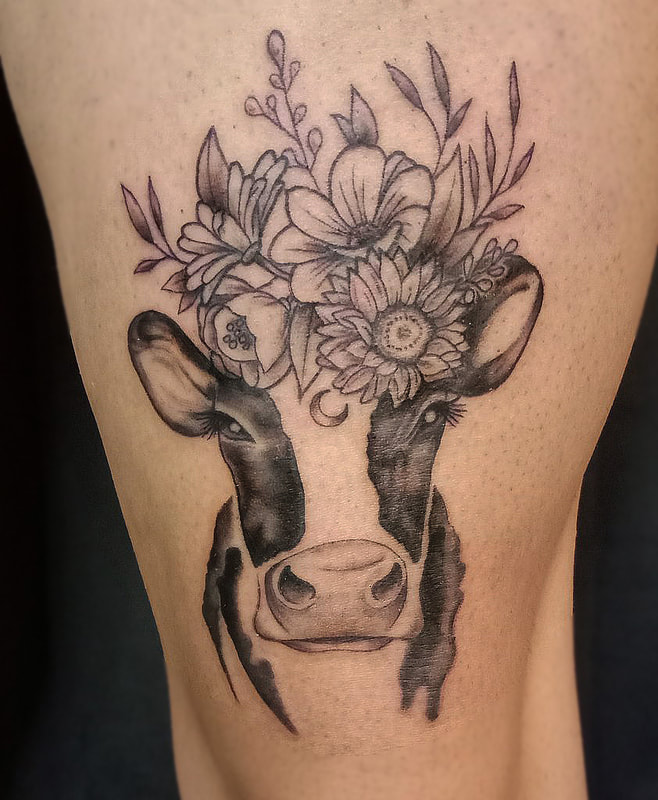 Floral cow done by Brian Haggerty at Overlord Tattoo Studio, Palm Coast.