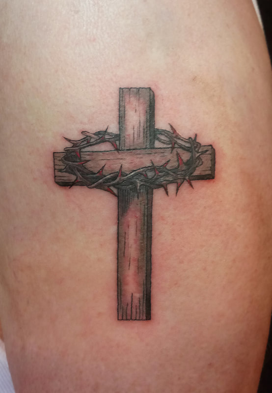 Cross tattoo done by Brian Haggerty at Overlord Tattoo Studio, Palm Coast, Flagler Beach FL. 