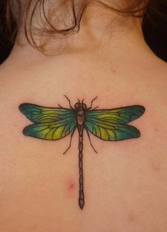 Dragonfly tattoo done by Brian Haggerty at Overlord Tattoo Studio, Palm Coast, Flagler Beach FL. 
