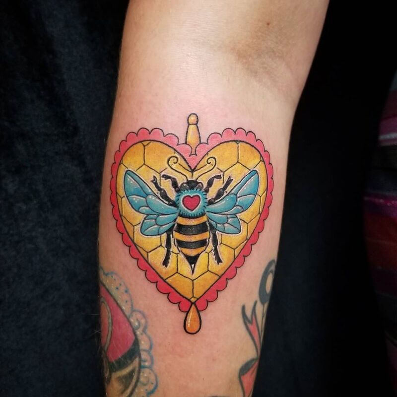 Heart bee tattoo done at Overlord Tattoo Shop in Palm Coast FL