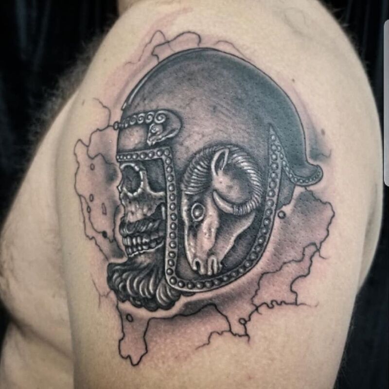 Helmet skull tattoo done at Overlord Tattoo Shop in Palm Coast FL
